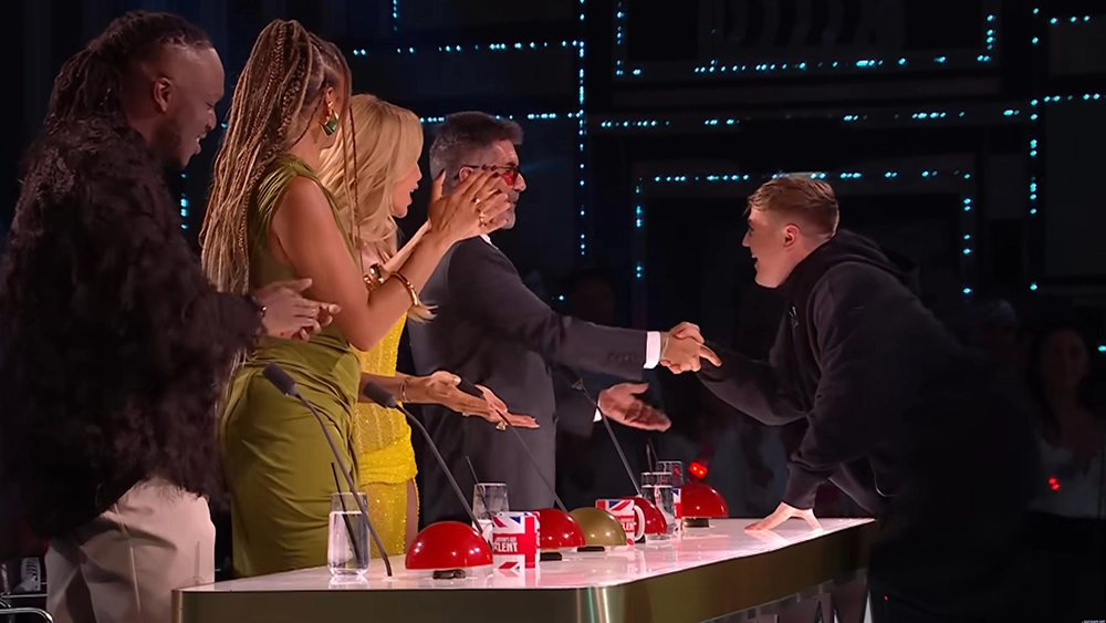 BGT Season 18 winner magician Harry Moulding greets the judges after his surprise cameo at the Season 19 Grand Final