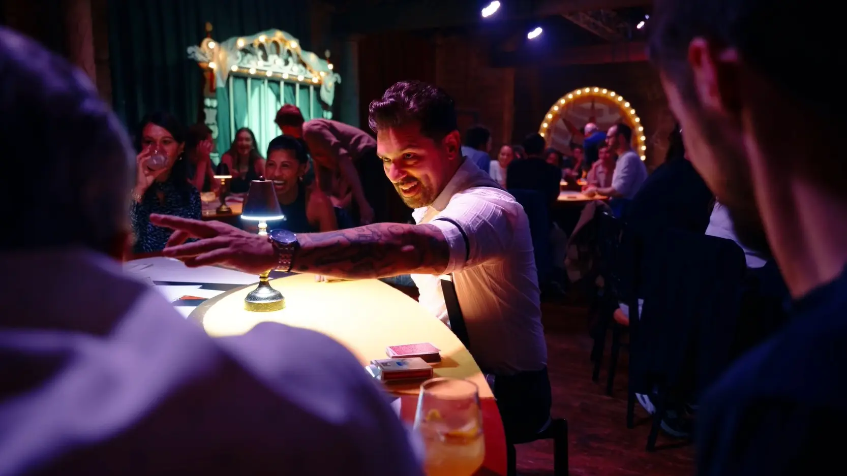 Audience members experience magic under their noses and on the stage. Photo: The Magicians Table